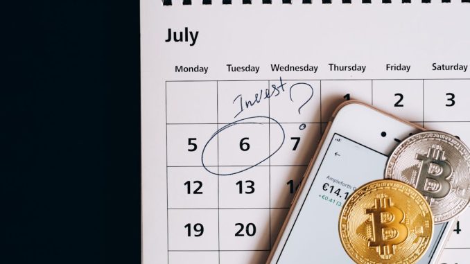 bitcoins-on-smartphone-lying-on-calendar