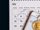 bitcoins-on-smartphone-lying-on-calendar