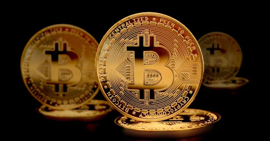 close-up-photograph-of-gold-coins-on-a-black-surface