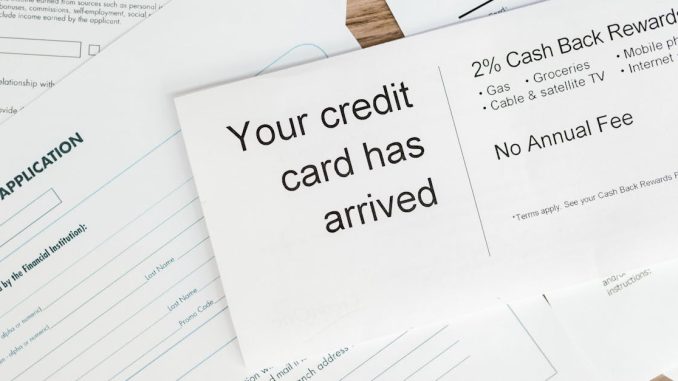 close-up-of-a-letter-announcing-the-arrival-of-a-credit-card-amidst-financial-documents