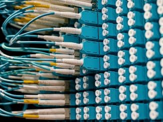 close-up-of-a-network-patch-panel-with-connected-blue-fiber-optic-cables