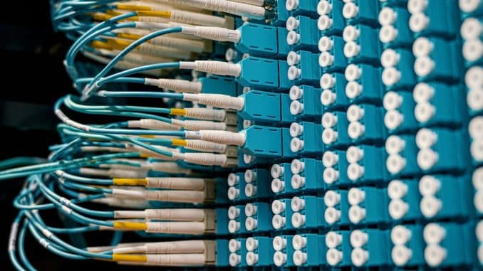 close-up-of-a-network-patch-panel-with-connected-blue-fiber-optic-cables