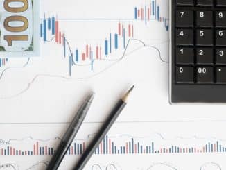 stock-analysis-workspace-featuring-charts-a-calculator-and-currency-for-data-driven-insights