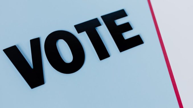 close-up-of-the-word-vote-on-a-minimal-background-emphasizing-voting-importance-1